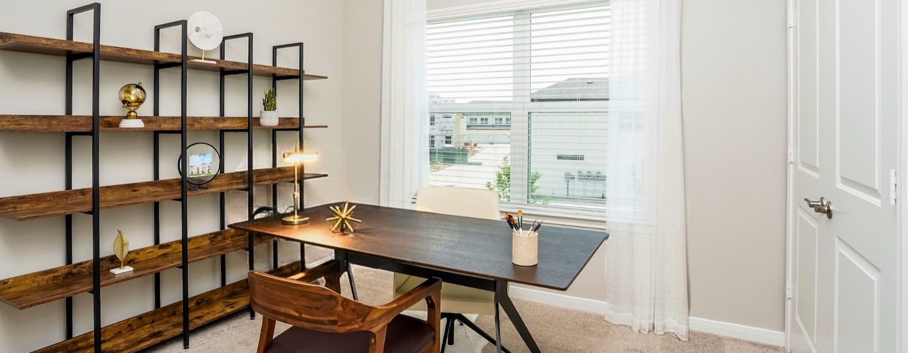 an office with a desk and chairs