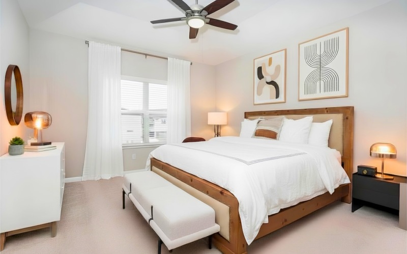 a bedroom with a bed and two nightstands