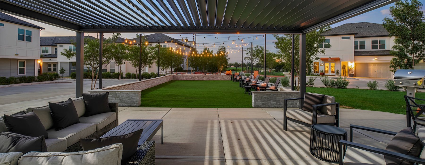 a patio with a couch and chairs