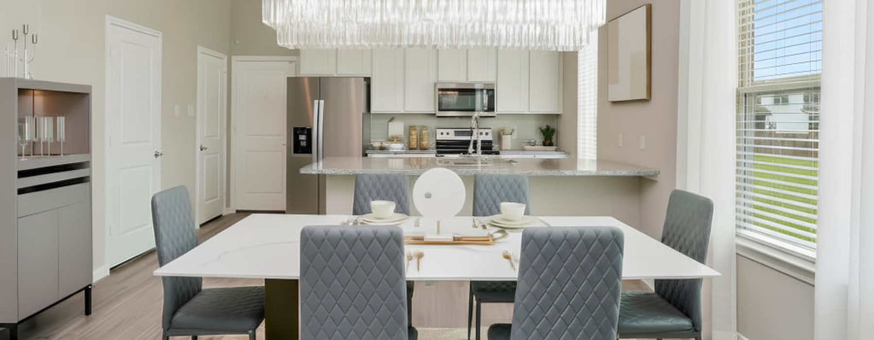 Open-concept kitchen and dining area in a 3-bedroom townhome at Enclave at Mason Creek in Katy, TX
