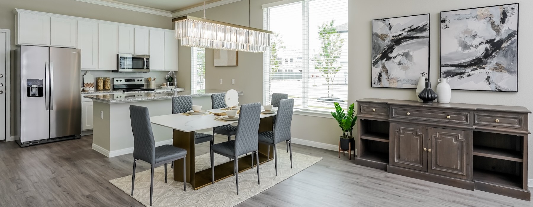 a kitchen with a dining table and chairs