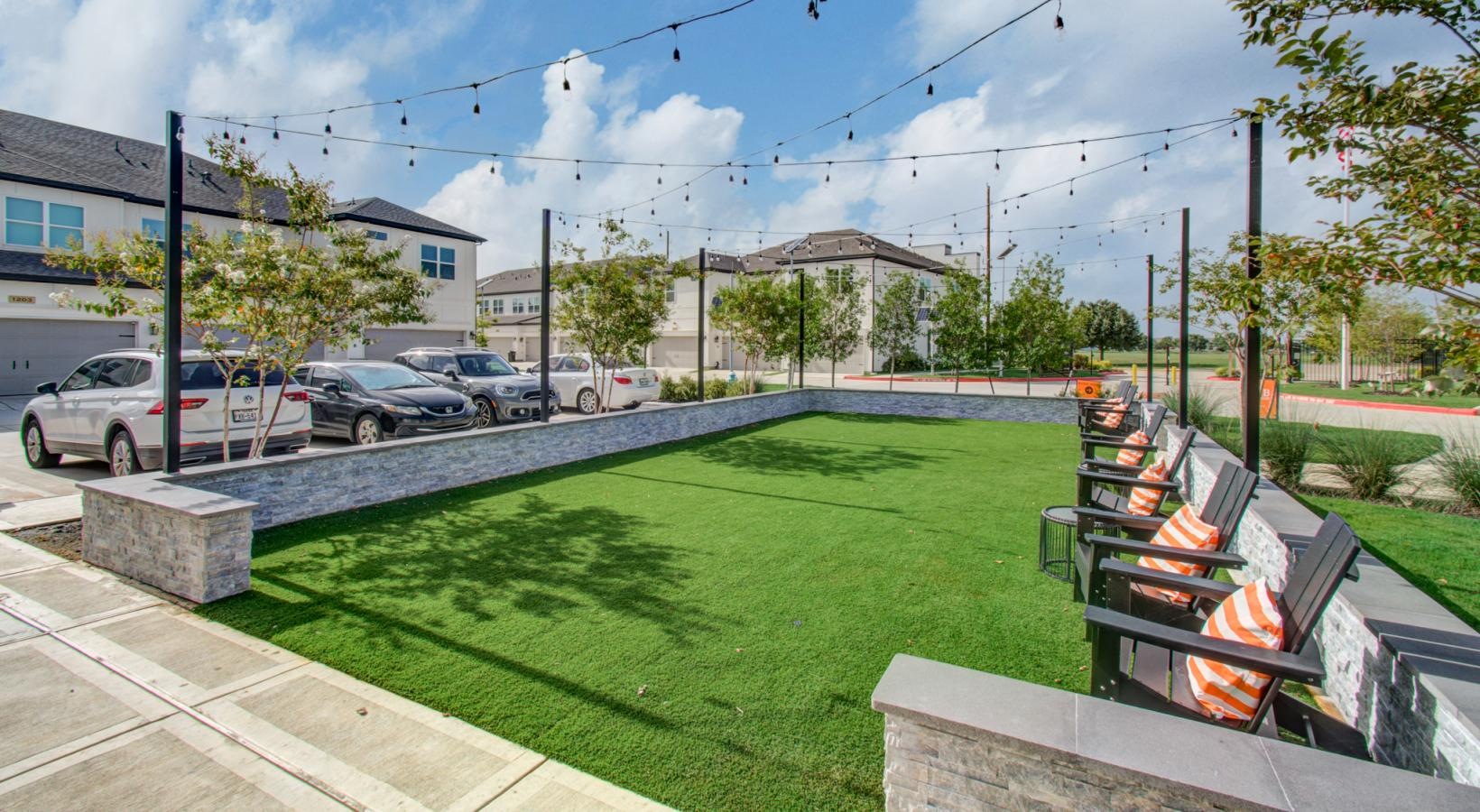 a grassy area with chairs